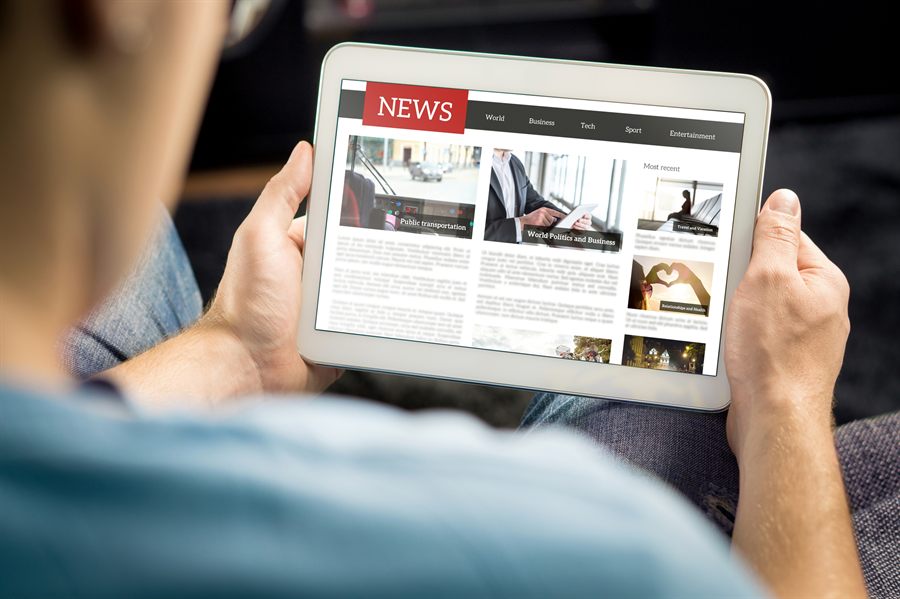 Person reading a website on a tablet